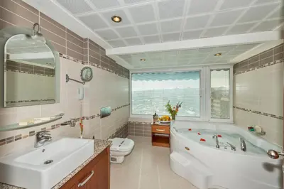 a bathroom with a tub and a sink and a toilet at Vatan Asur Hotel in Istanbul