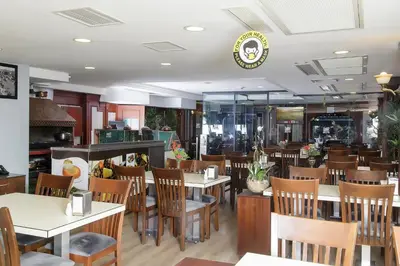 a dining room with tables and chairs in a restaurant at Vatan Asur Hotel in Istanbul