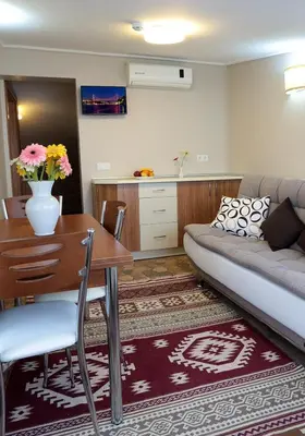 a living room with a couch and a table at Aycan Sultan Apart Hotel in Istanbul