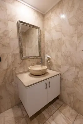 a bathroom with a sink and a mirror at Asia Business Suites in Istanbul