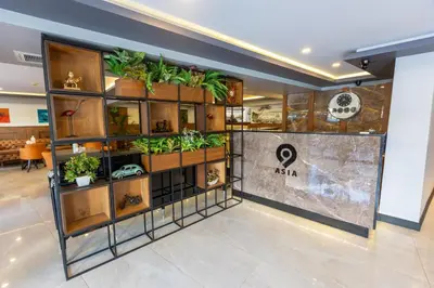 a store with plants on shelves in a lobby at Asia Business Suites in Istanbul