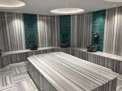 a room with a bed and green walls at Gold Majesty Hotel in Bursa