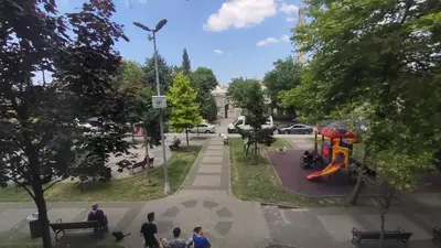 a group of people walking around a park with a playground at Hotel Torun Istanbul Old City in Istanbul