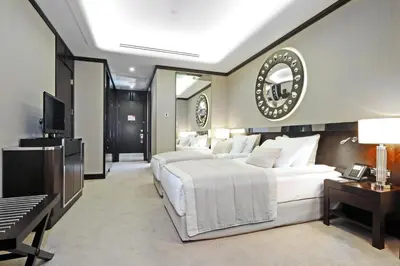 a bedroom with a large bed and a television at Crowne Plaza Bursa Convention Center & Thermal Spa by IHG in Bursa