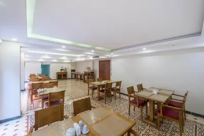 a dining room with wooden tables and chairs at Lalinn Hotel in Istanbul