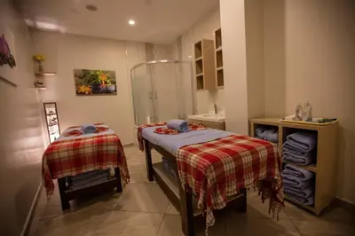 a small bathroom with two beds and a shower at Dodo Hotel Spa Old City in Istanbul