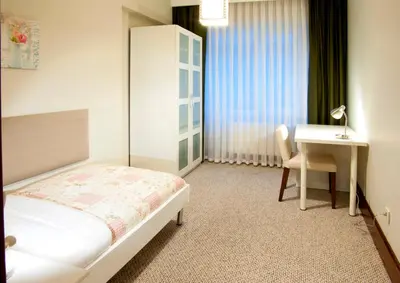 a bedroom with a bed and a desk and a table at 116 Residence in Istanbul