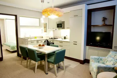 a kitchen and dining room with a table and chairs at 116 Residence in Istanbul