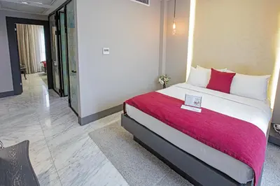 a hotel room with a bed with a red blanket at Nowy Efendi Hotel - Special Category in Istanbul