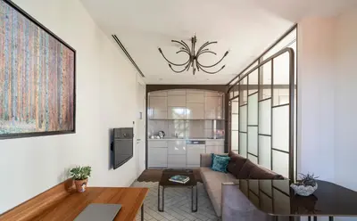 a living room with a couch and a table at Upsuites Hotel in Istanbul
