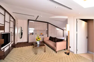 a living room with a couch and a table at Upsuites Hotel in Istanbul