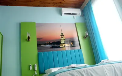 a bedroom with a picture of the kremlin at HOTEL MİKLAGORD in Istanbul
