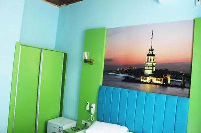 a bathroom with a picture of a building on the wall at HOTEL MİKLAGORD in Istanbul