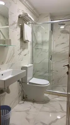 a bathroom with a toilet and a shower and a sink at Hotel Wiva in Istanbul