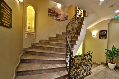 a staircase in a building with a wrought iron railing at Yılsam Sultanahmet Hotel in Istanbul