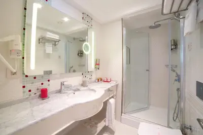 a bathroom with a sink and a shower at Yılsam Sultanahmet Hotel in Istanbul