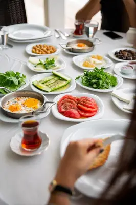 a white table with plates of food on it at Premier Vista Hotel in Silivri