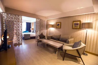 a living room with a couch and a bed at Zimmer Bosphorus Hotel in Istanbul