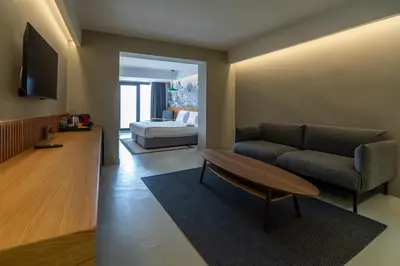 a living room with a couch and a bed at Zimmer Bosphorus Hotel in Istanbul
