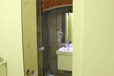 a bathroom with a sink and a shower at Element Suites in Istanbul