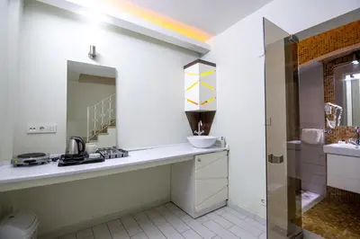 a kitchen with a counter and a rainbow on the wall at Element Suites in Istanbul
