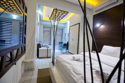 a bedroom with a large bed and a balcony at Element Suites in Istanbul