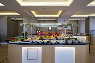 a buffet with many different types of food on a counter at The Berussa Hotel in Bursa