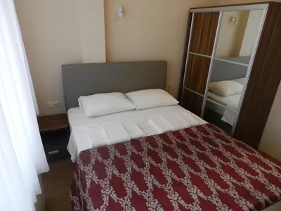 a bedroom with a bed with a red and white blanket at Hagia Sophia Apartment in Istanbul