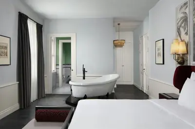 a bedroom with a bath tub and a bed at Adahan DeCamondo Pera, Autograph Collection in Istanbul