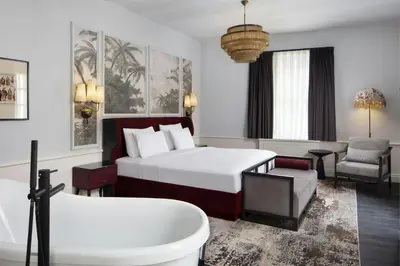 a hotel room with a bed and a bath tub at Adahan DeCamondo Pera, Autograph Collection in Istanbul