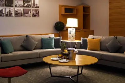 a living room with a couch and a coffee table at Hotel Yayoba in Tekirdag
