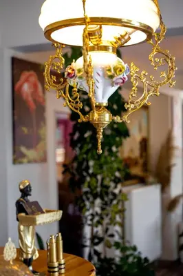 a gold chandelier hanging over a table at Lagun Palas in Yalova
