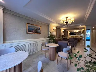 a restaurant with tables and chairs in a room at Gul Hotel in Istanbul