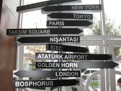 a bunch of street signs on a pole at Taxim Express Bosphorus Hotel in Istanbul