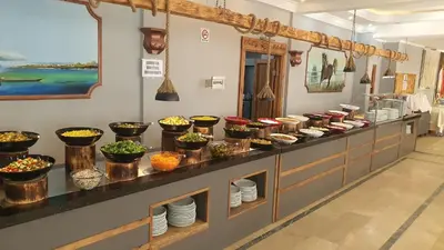 a buffet line with bowls of food on display at Hotel Yasemin in Erdek