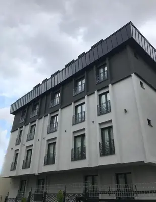 a large white building with windows on the side of it at Anka Premium Hotel in Istanbul