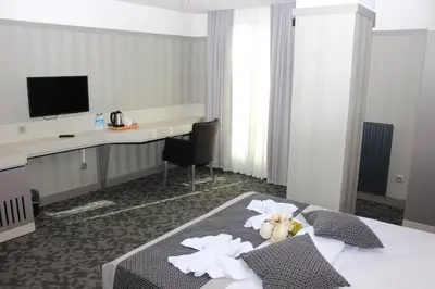 a hotel room with a bed with flowers on it at Anka Premium Hotel in Istanbul