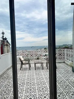 a view of a balcony with a table and a bench at Ersari Hotel in Istanbul