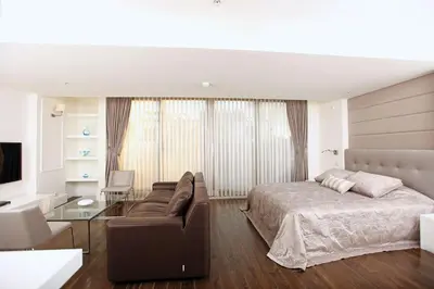 a bedroom with a bed and a couch at Pera Residence in Istanbul