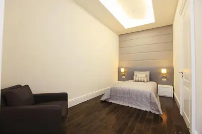 a bedroom with a bed and a couch at Pera Residence in Istanbul