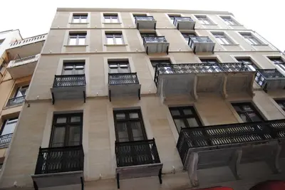 a tall building with balconies on the side of it at Pera Residence in Istanbul
