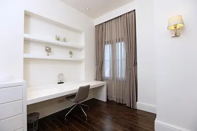 a white desk with a chair in a room at Pera Residence in Istanbul