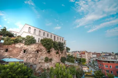 a building sitting on top of a stone wall at Gulliver Mansion Hotel in Istanbul