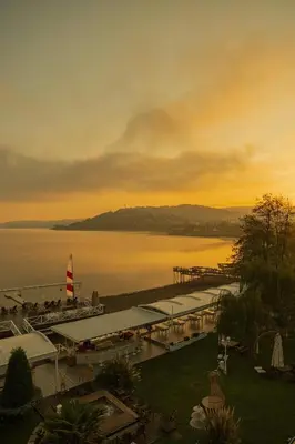 a view of a marina on the water at sunset at Lale Hotel in Sapanca