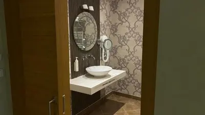 a bathroom with a sink and a mirror at Lale Hotel in Sapanca