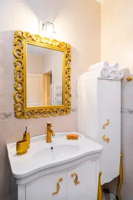 a bathroom with a white sink and a mirror at Ajda Haus Nisantasi in Istanbul