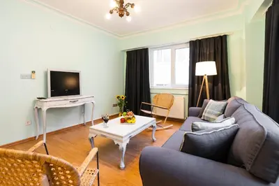 a living room with a couch and a table at Ajda Haus Nisantasi in Istanbul