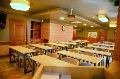 an empty dining room with tables and chairs at Sarajevo Suit Hotel in Kocaeli