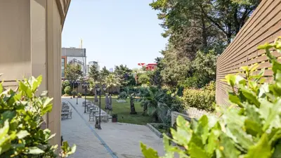 a view of a park with benches and trees at Istanbul Gonen Hotel in Istanbul