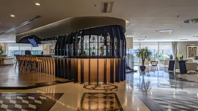 a bar in a lobby with a lot of wine bottles at Istanbul Gonen Hotel in Istanbul